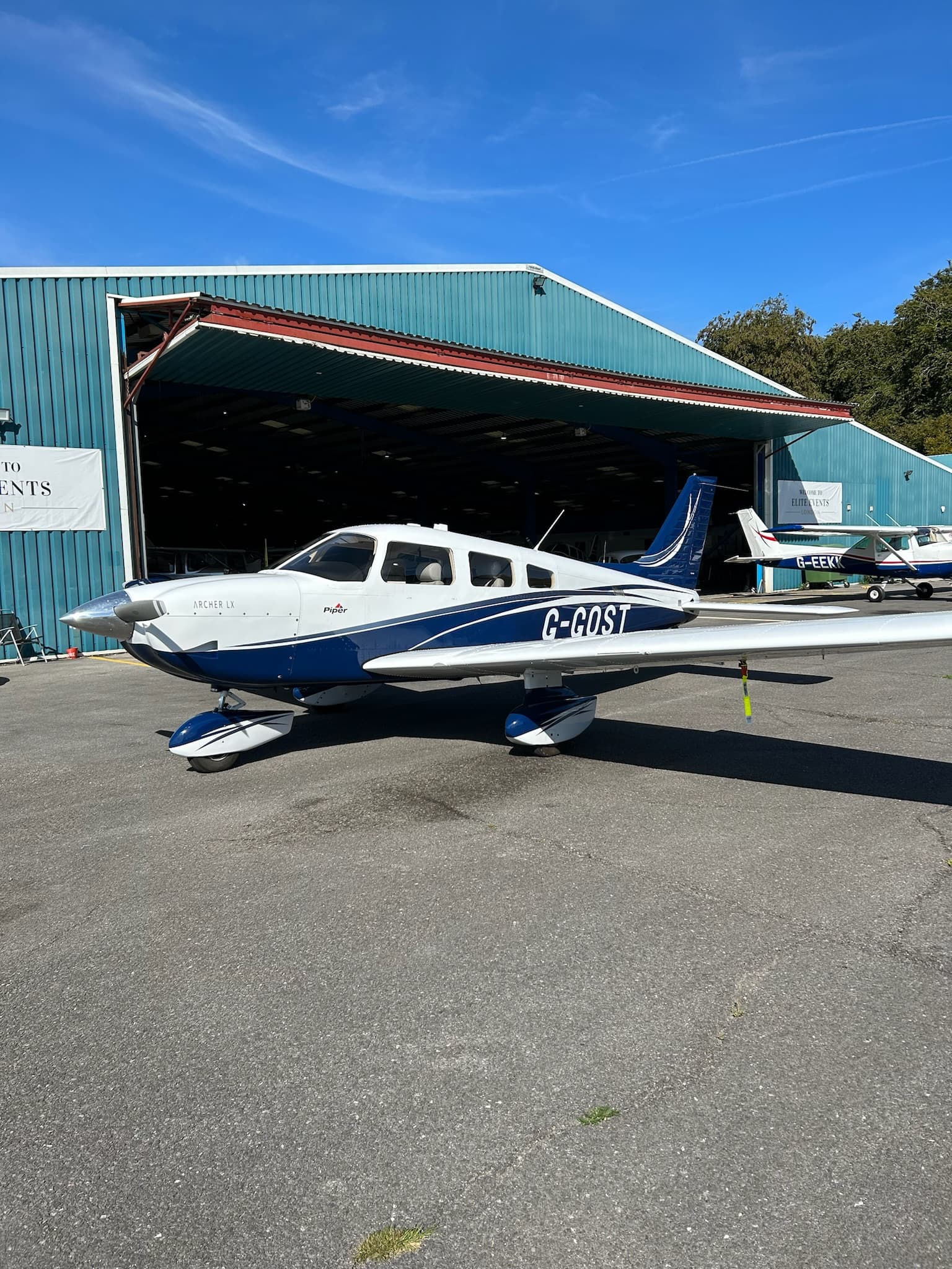 Piper Archer G-GOST outside hangar